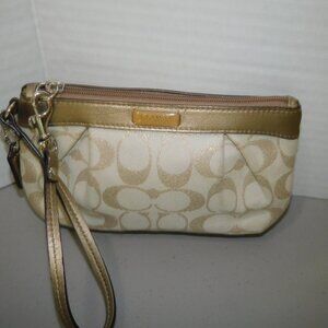 Coach Signature cream and gold wristlet